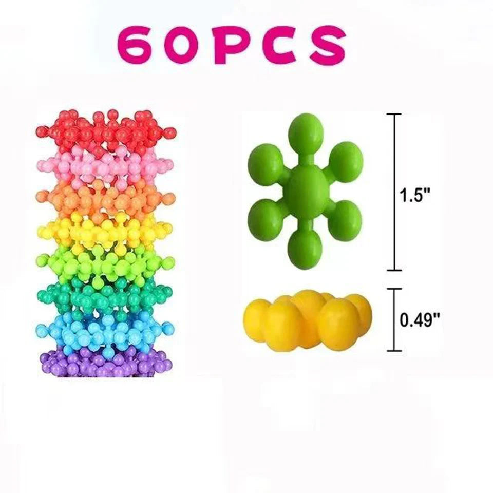 Colorful fidget toys including a rainbow tower, green stress ball, and yellow cube with measurements on a white background.