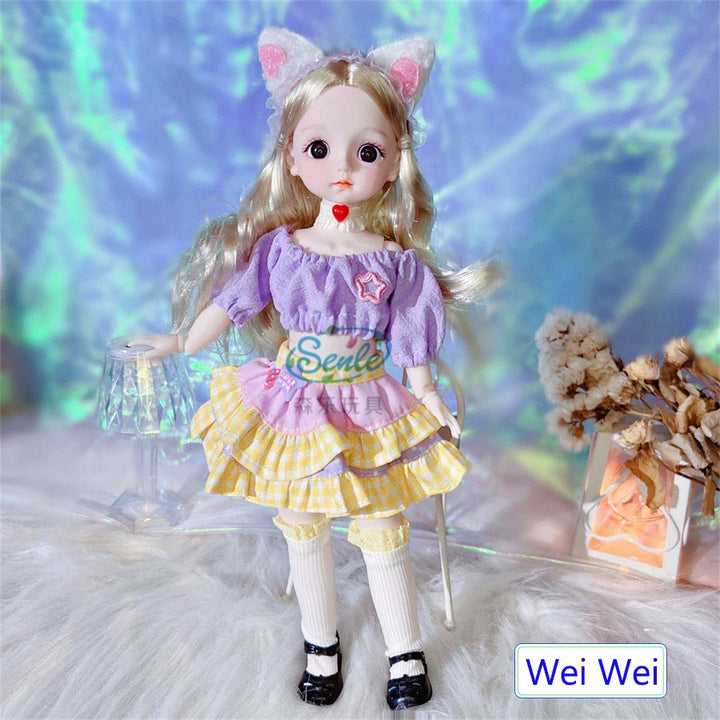 Doll with cat ears and a purple dress on a soft surface with a blurred background.
