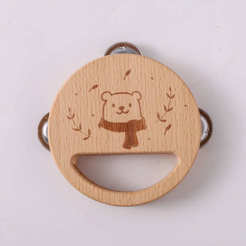 Wooden teething ring with bear design on a white background.