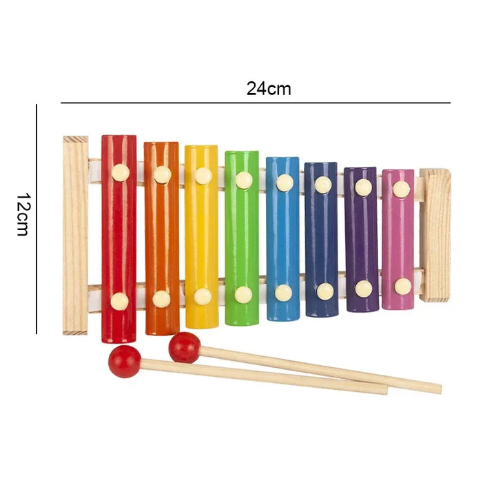 Colorful wooden xylophone with measurement details on a white background.