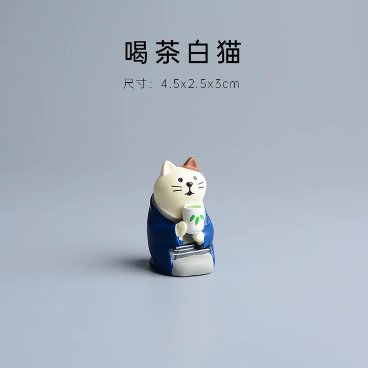 Cat figurine holding a cup on a gray background with text indicating dimensions.