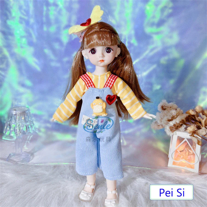 Doll wearing a yellow and blue outfit with a heart-shaped accessory, standing against a decorative background.