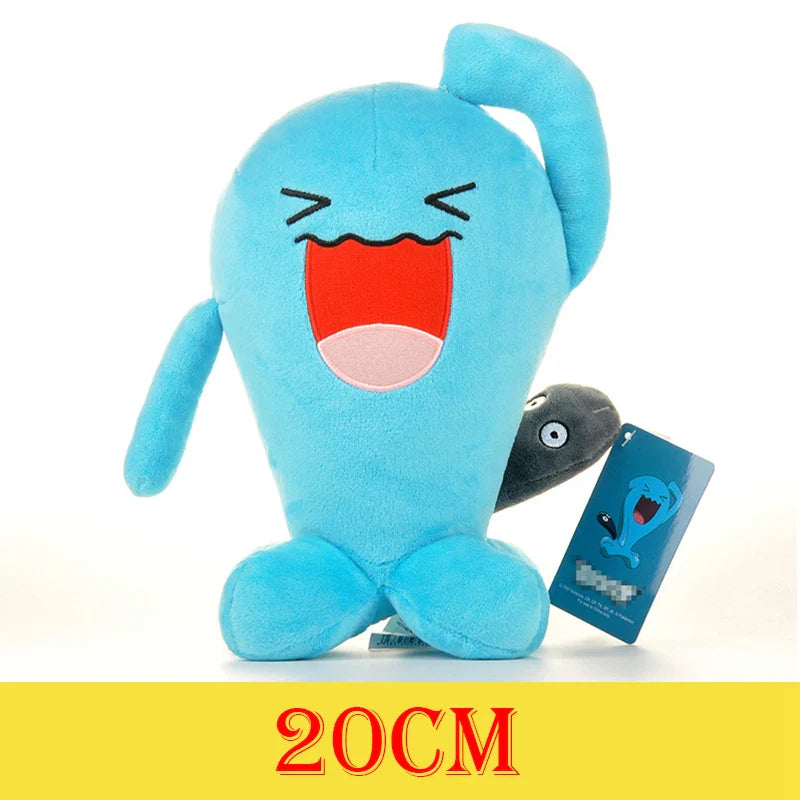 Blue plush toy with a surprised expression next to its packaging on a white background.