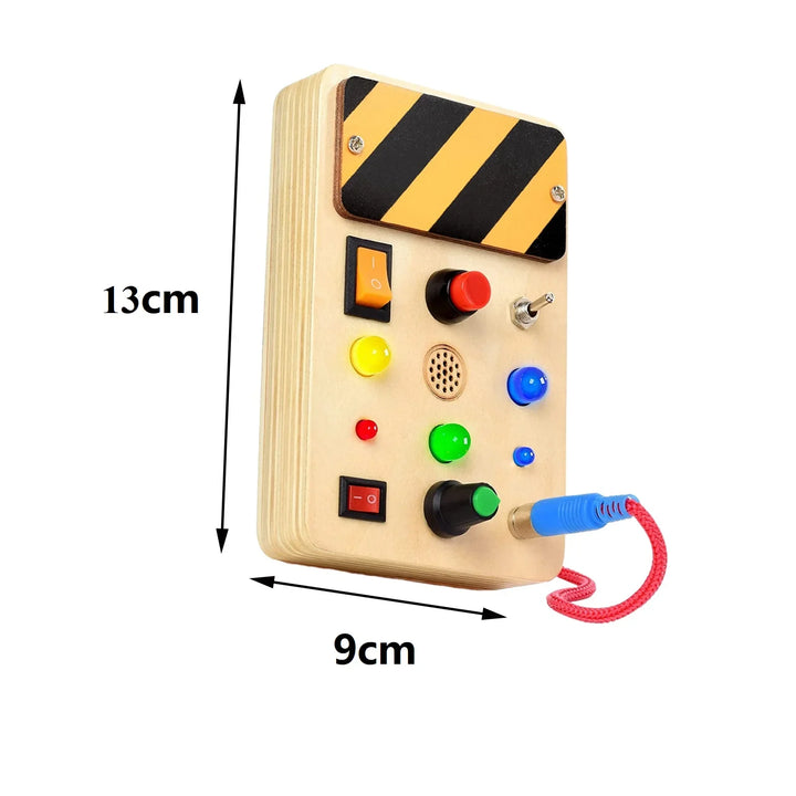 Wooden control panel with colorful buttons and a cable, showing dimensions on a white background.