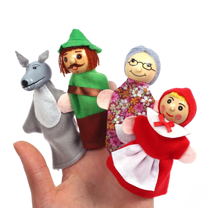 Set of finger puppets including a donkey, a man, an elderly woman, and a girl on a hand.
