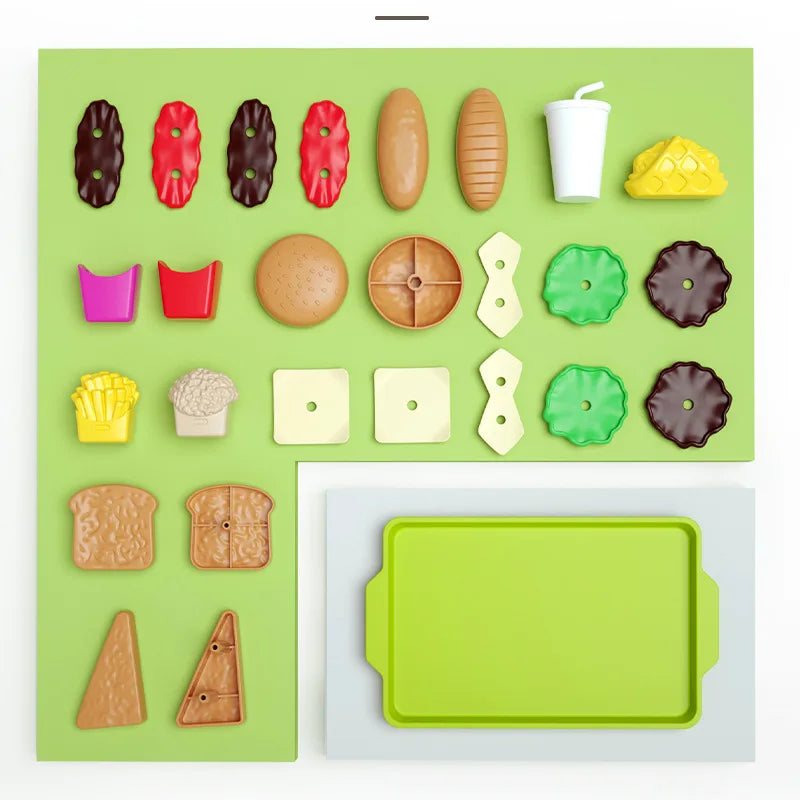 Colorful toy food items and a green tray on a white background.