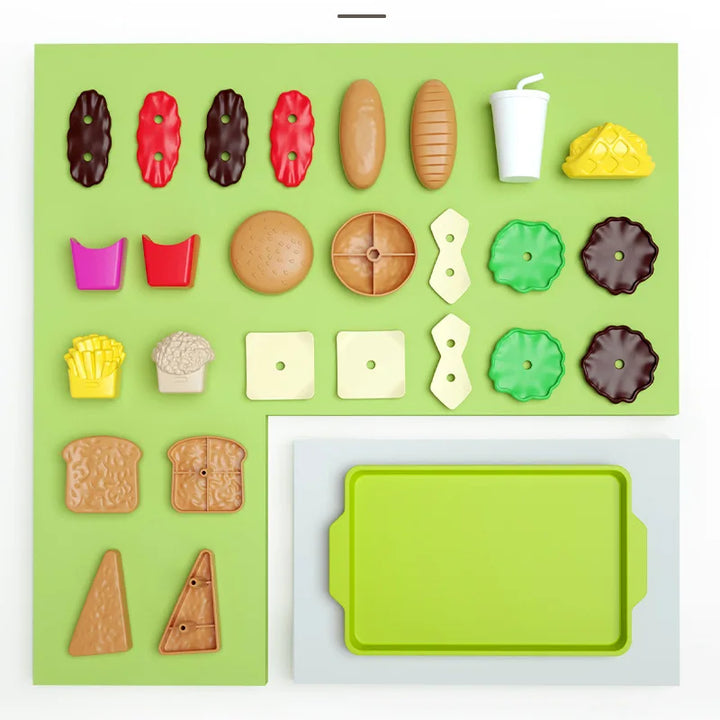 Colorful toy food items and a green tray on a white background.