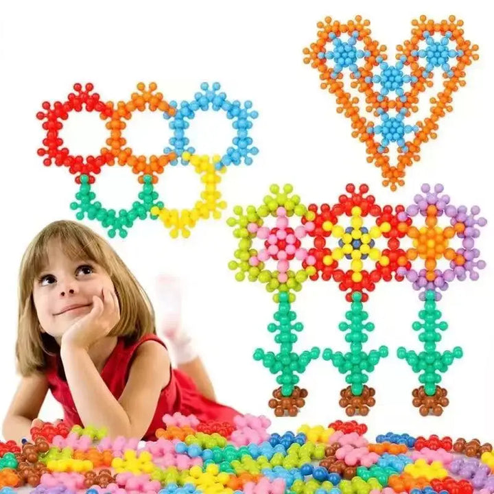 Colorful bead toys shaped like flowers and hearts with a child playing with them.
