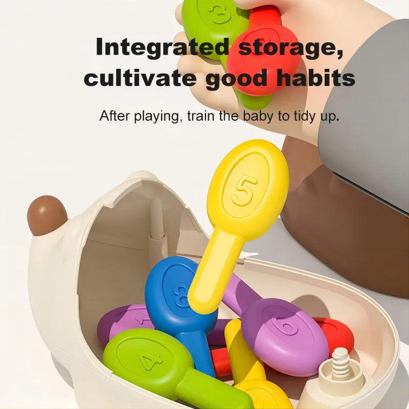 Colorful toy keys with numbers integrated into a storage container, promoting good habits.