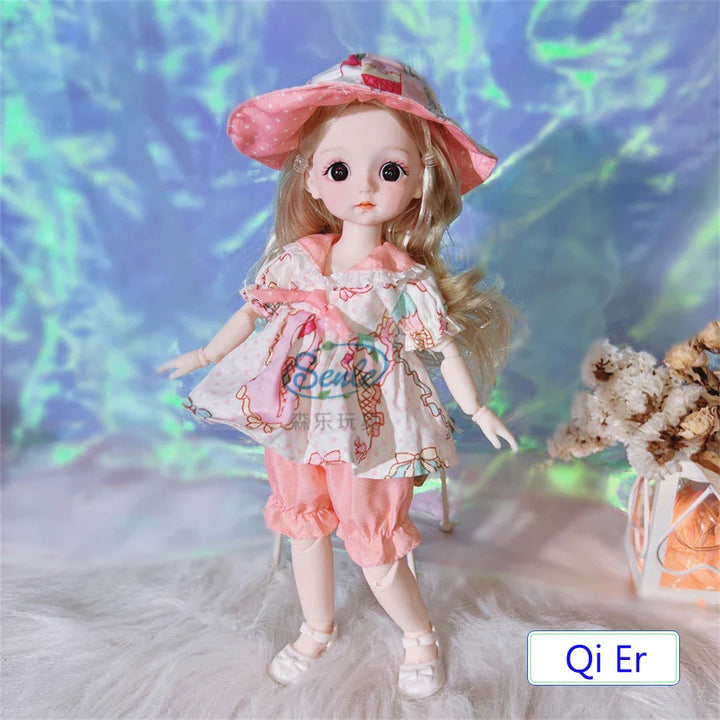 Doll in a pink outfit with a hat on a textured surface with a blurred background.