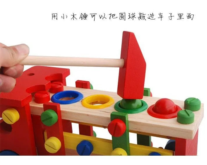 Colorful wooden toy with a hammer and various shaped holes on a white background.