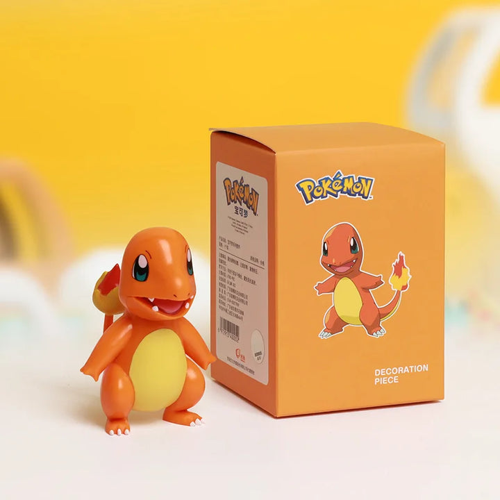 Pokémon Charmander figurine with packaging on a yellow background.