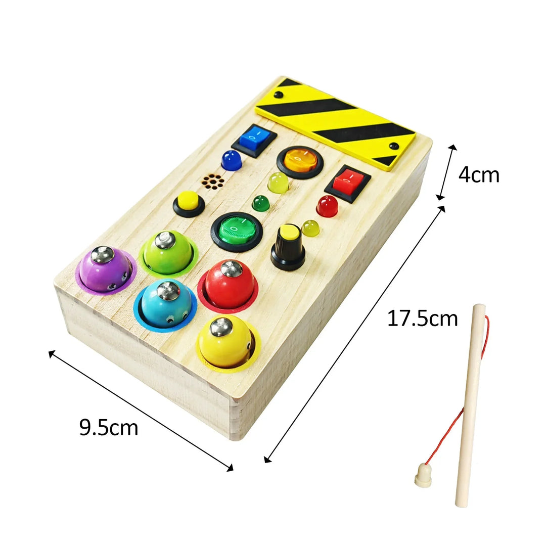 Wooden toy control panel with colorful buttons and a measuring stick for dimensions.