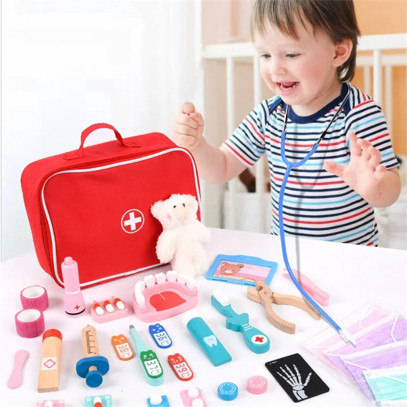 Child playing with toy medical set and red first aid kit.