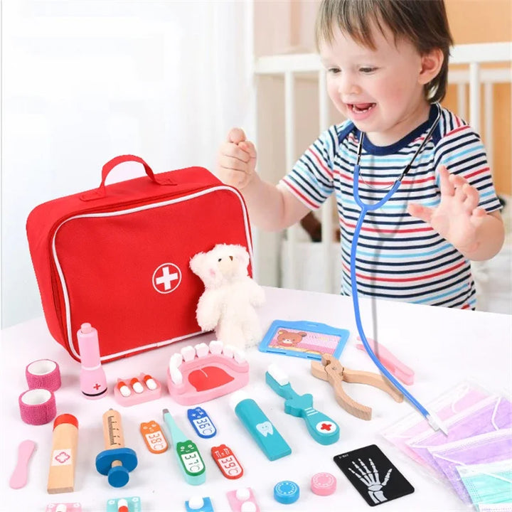 Child playing with toy medical set and red first aid kit.