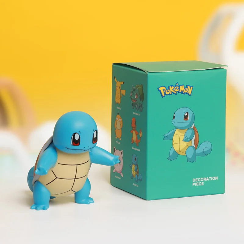 Pokémon Squirtle figurine next to its packaging on a yellow background.