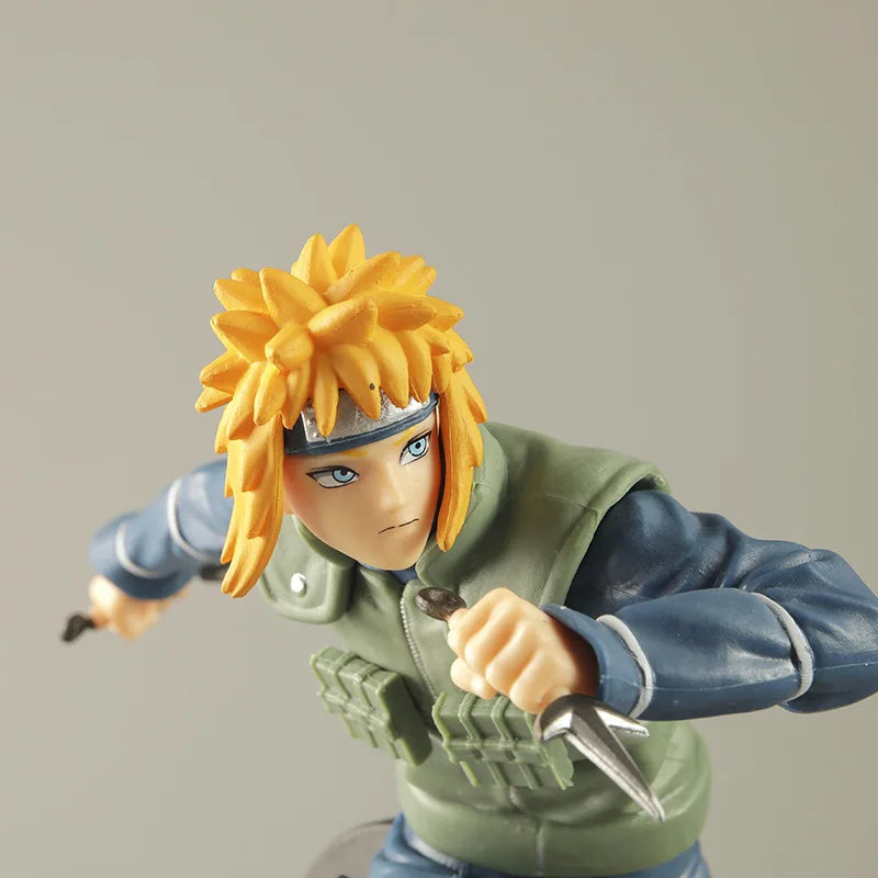 Action figure with spiky hair and green and blue outfit on a plain background.