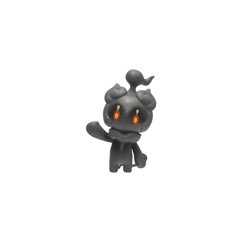 Black figurine with red eyes on a white background.