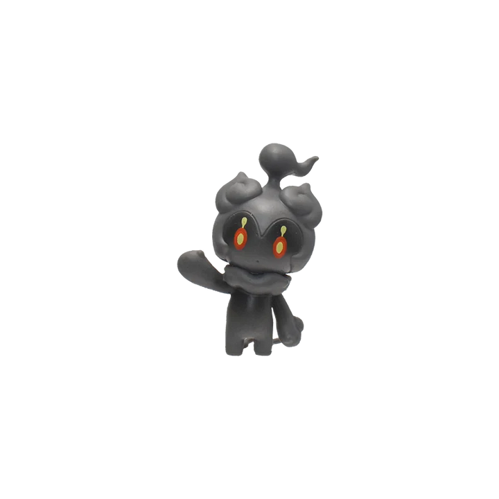 Black figurine with red eyes on a white background.