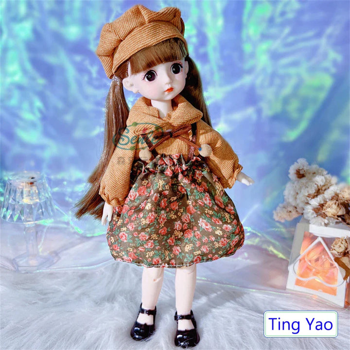Doll wearing a brown coat and floral dress with a blurred background.