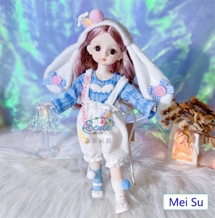 Doll with bunny ears and a blue outfit standing on a textured surface with a blurred background.