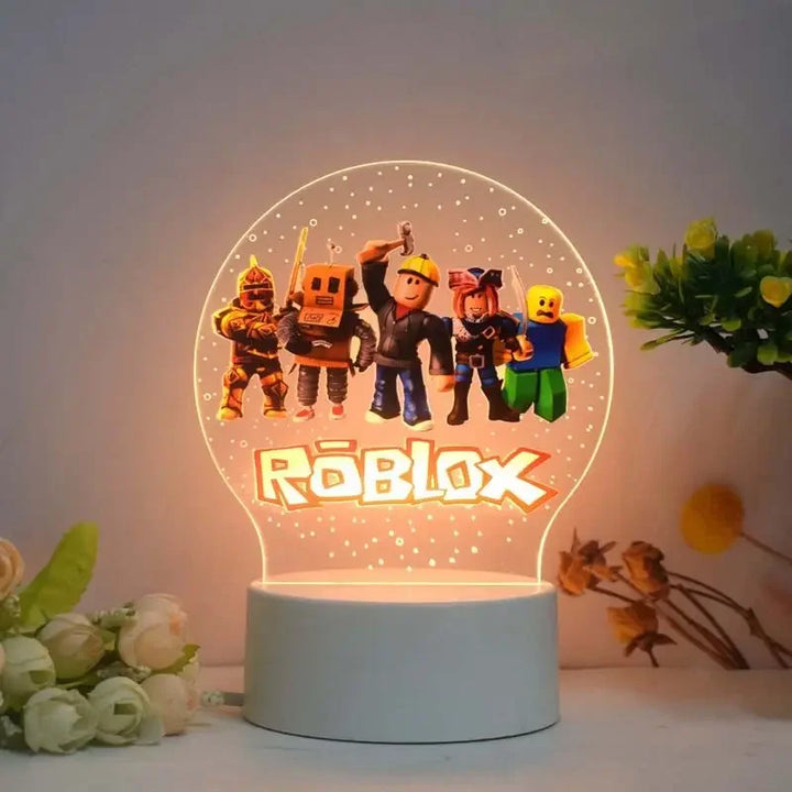 Roblox-themed night light with character illustrations on a white surface.