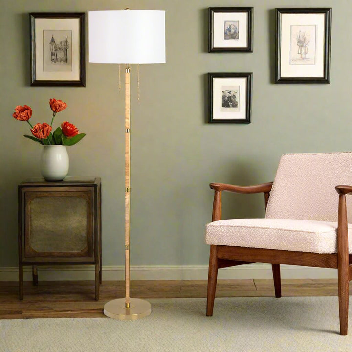 Stellar Wood Rattan Tube, Gold Brass Metal and White Linen Shade Floor Lamp with Background.