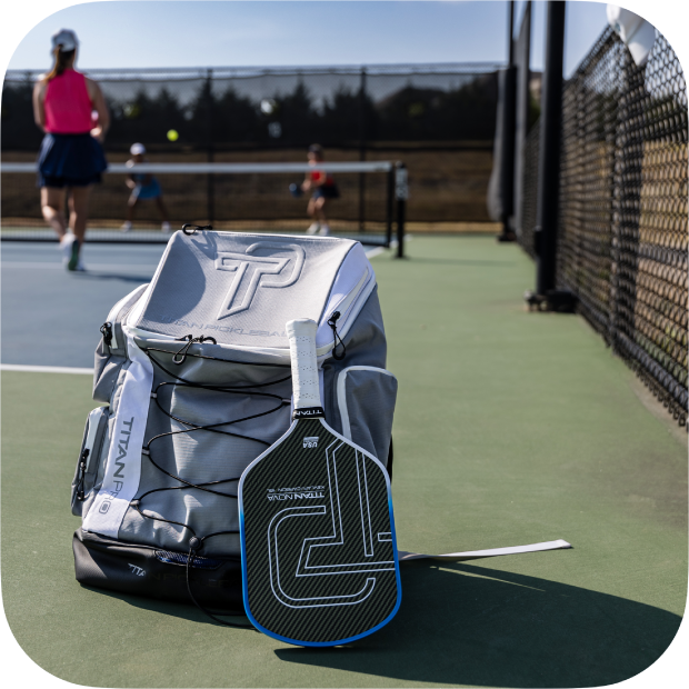 Pickleball Paddle and Bag on Court.