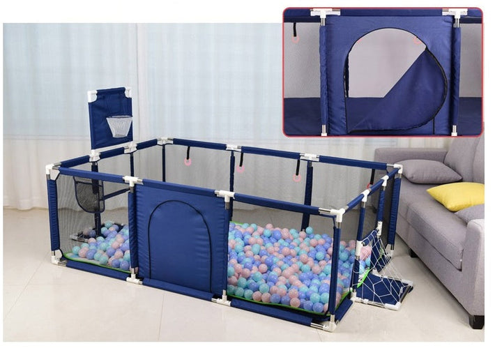 Children's playpen with ball pit and additional play elements in a room.