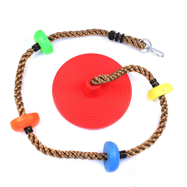 Red disc with a braided rope and colorful plastic beads on a white background.