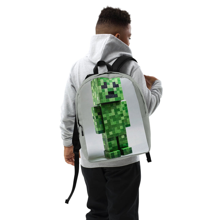 Person wearing a backpack with a pixelated green character design on a white background.