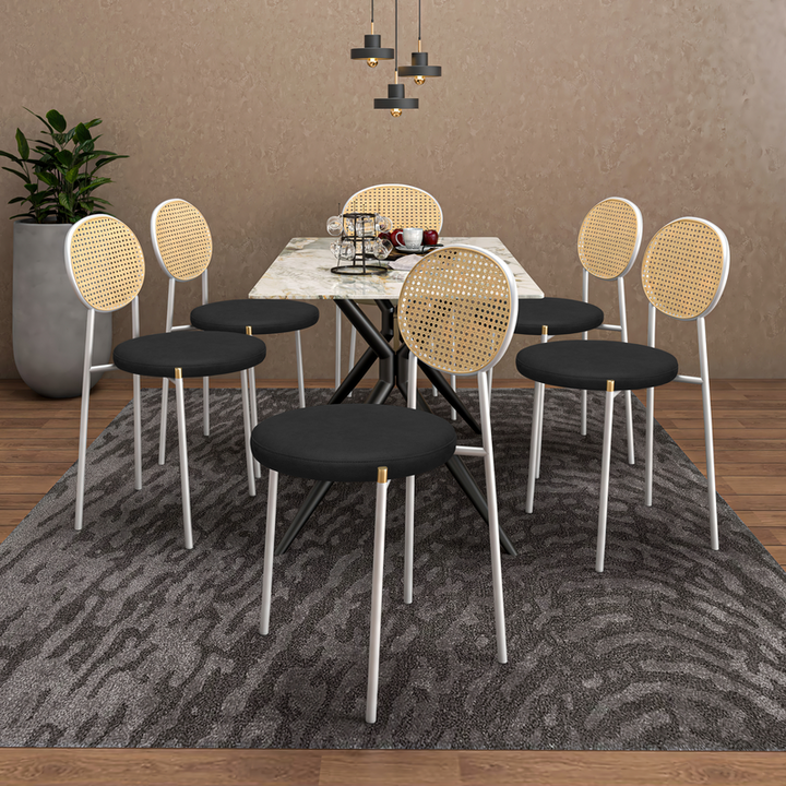 LeisureMod Euston Modern Wicker Dining Chair with White Frame and Leather Seat in Charcoal Set of 2 at Table.