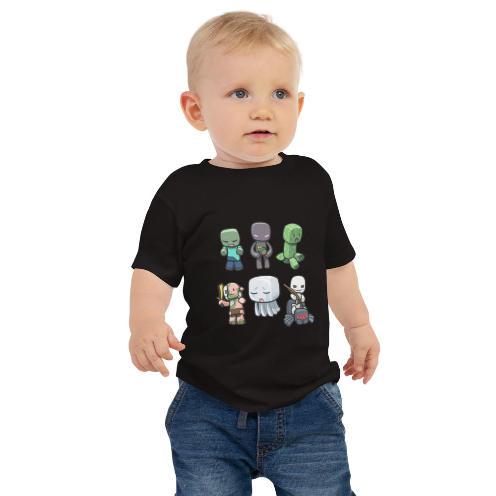 Child wearing a black t-shirt with colorful character designs on a white background.
