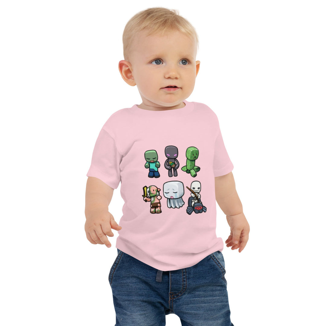 Child wearing a pink t-shirt with cartoon character design on a white background.