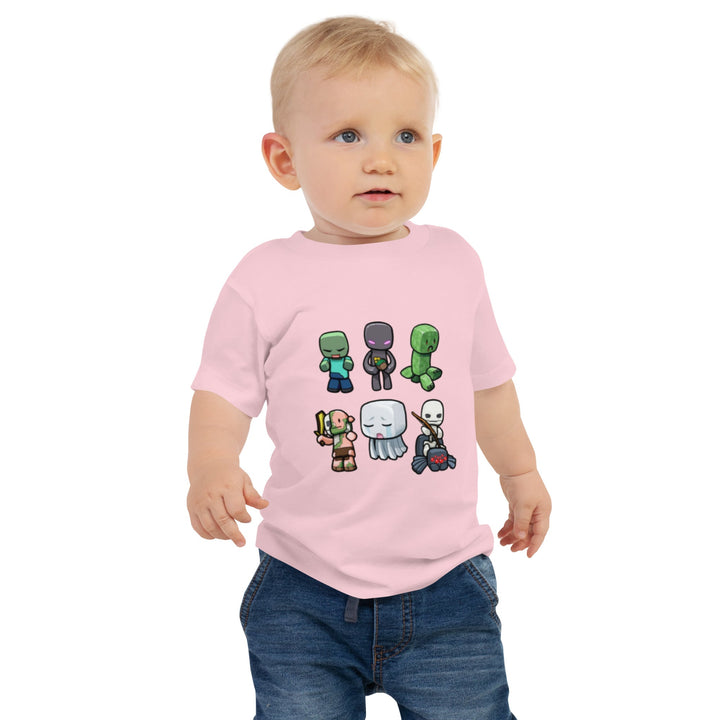 Child wearing a pink t-shirt with cartoon character design on a white background.