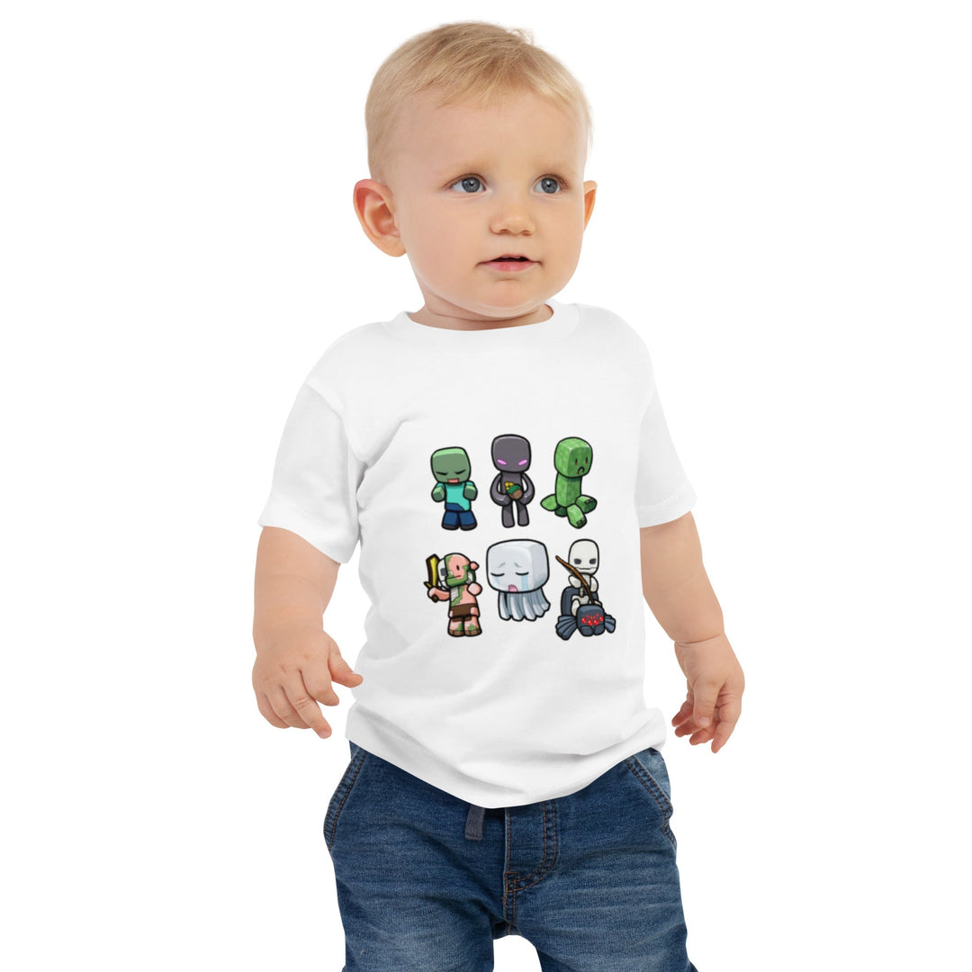 Child wearing a white t-shirt with cartoon character designs on a white background.