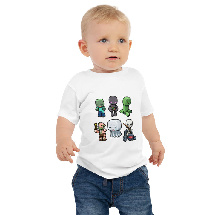 Child wearing a white t-shirt with cartoon character designs on a white background.