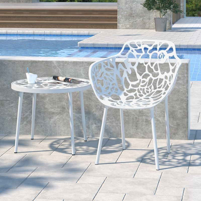 LeisureMod Modern Devon Aluminum Armchair White at Table.