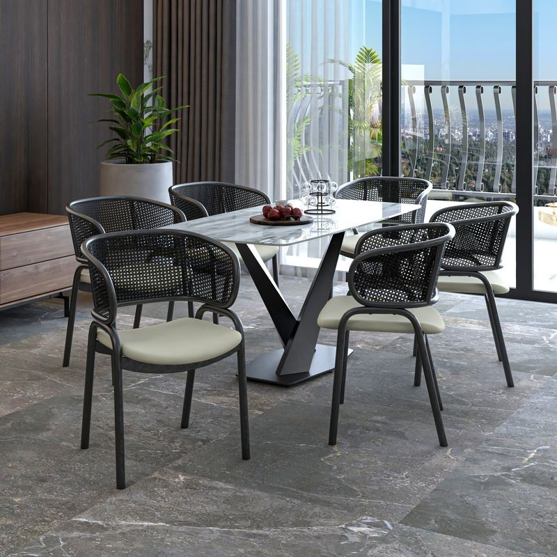 LeisureMod Ervilla Dining Armchair in Black Steel Frame with Black Wicker Back and Beige Seat at Table.