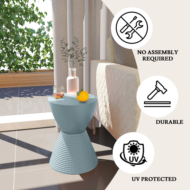 LeisureMod Modern Round Boyd Side Table Dusty Blue by Couch.