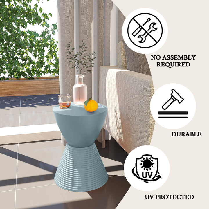 LeisureMod Modern Round Boyd Side Table Dusty Blue by Couch.