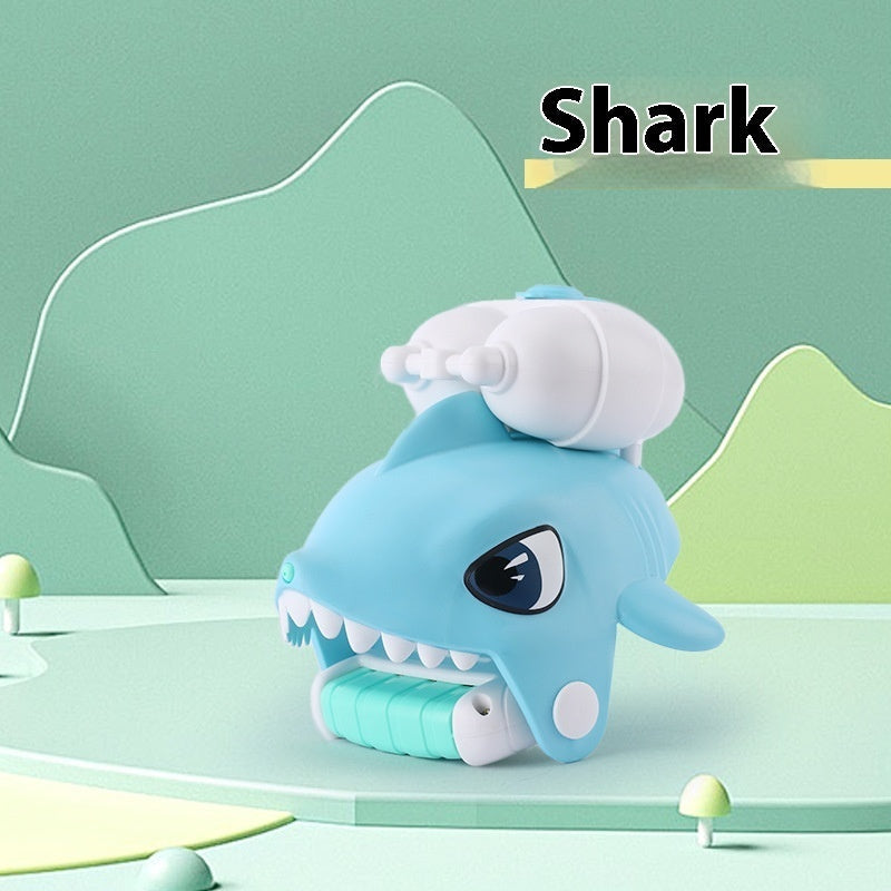Toy shark with a white hat on a green background.
