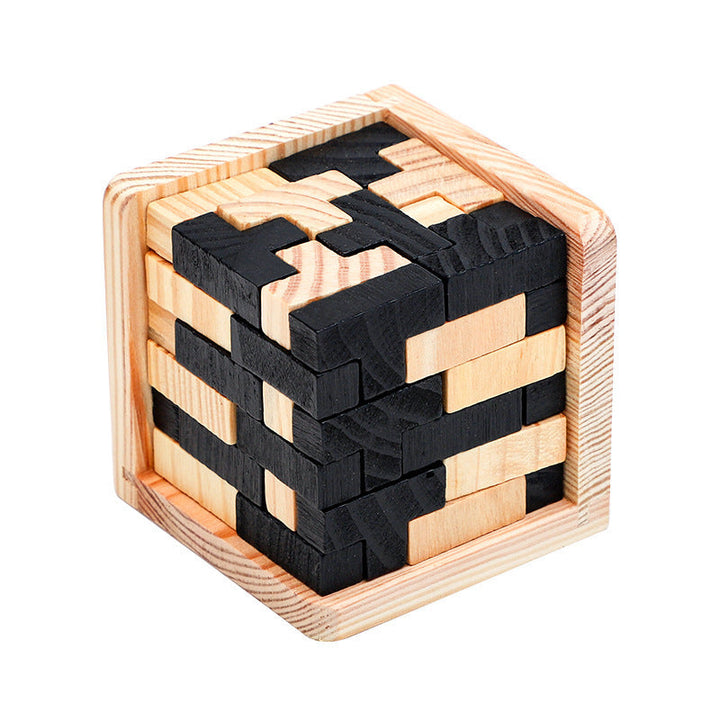 Wooden puzzle cube with black and natural wood pieces on a white background.