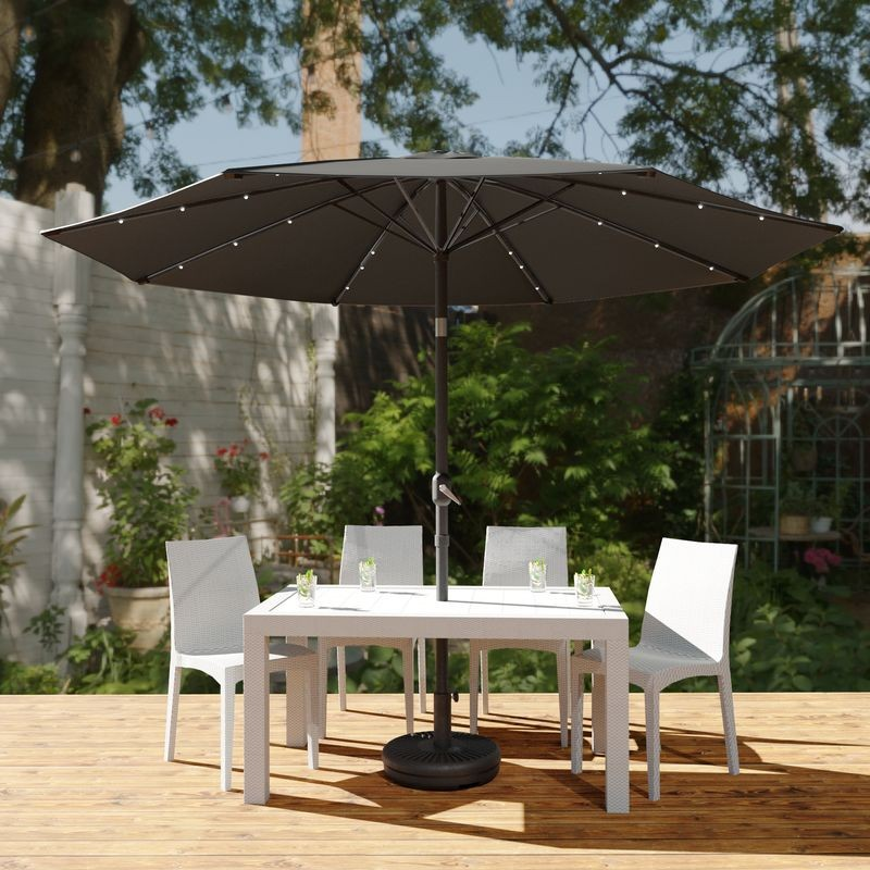 LeisureMod Sierra Outdoor Patio Umbrella with Base in Gray Outside.