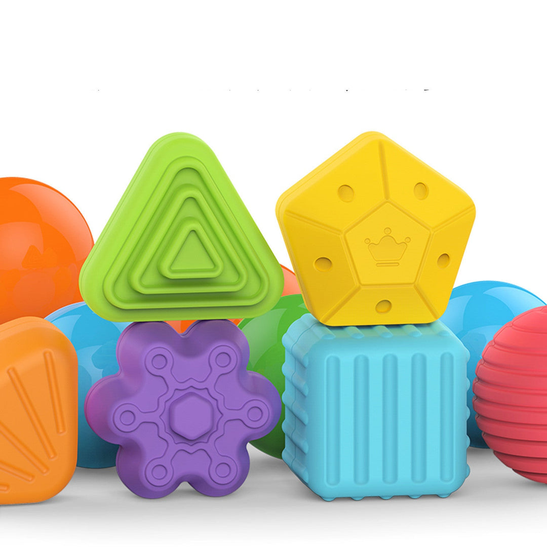 Colorful set of geometric-shaped toys on a white background.
