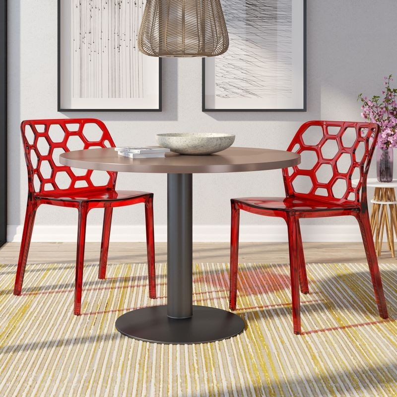 LeisureMod Modern Dynamic Dining Chair, Set of 2 Transparent Red at Table.