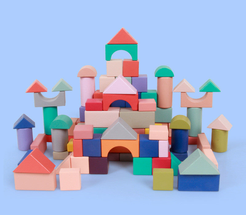 Colorful wooden blocks stacked against a light blue background.