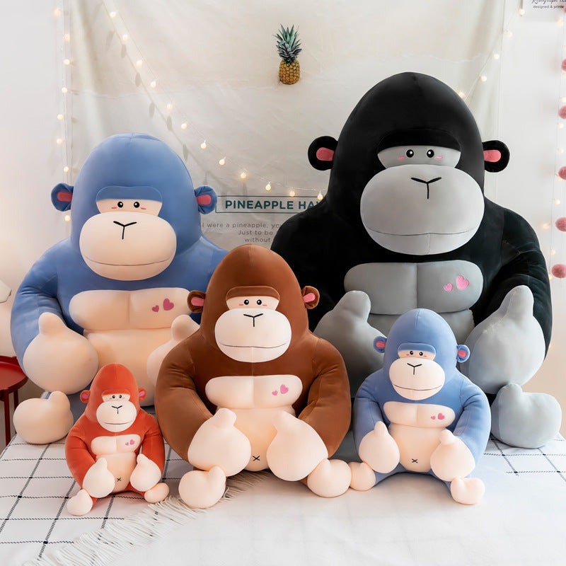 Set of colorful monkey plush toys on a light background.