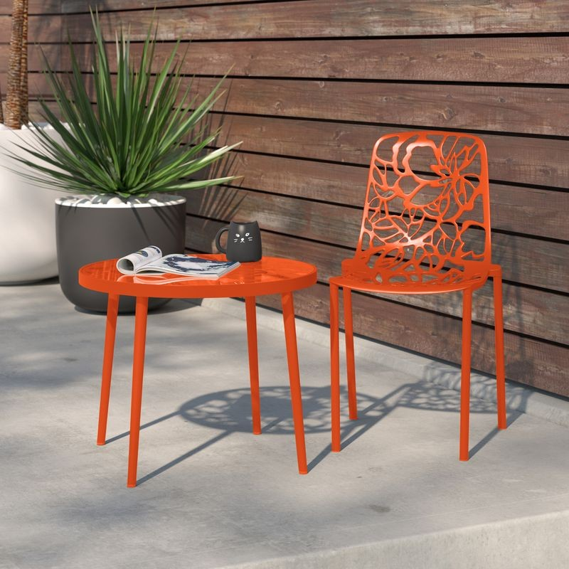 LeisureMod Modern Devon Aluminum Chair Orange at Table.