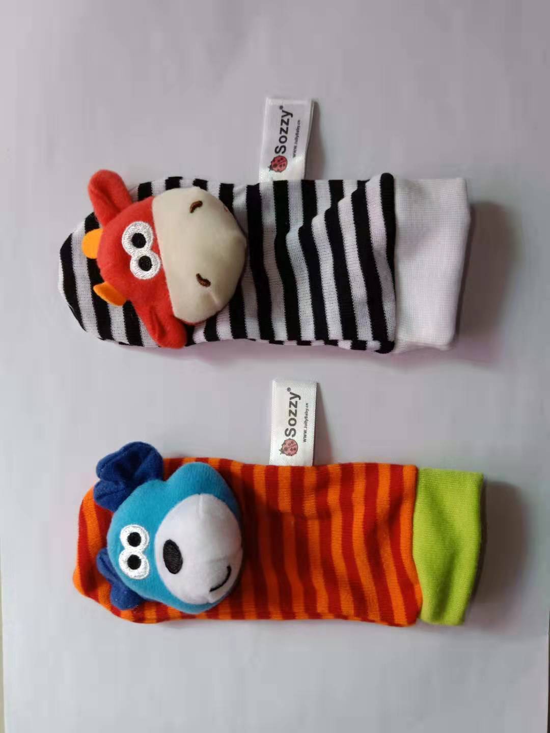 Two colorful children's socks with cartoon characters on a white background.